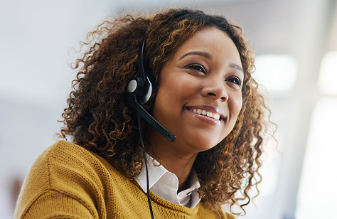 Woman smiling while wearing a headset